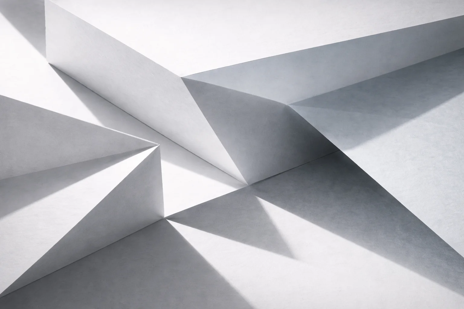 Abstract paper folds casting geometric shadows in natural light design